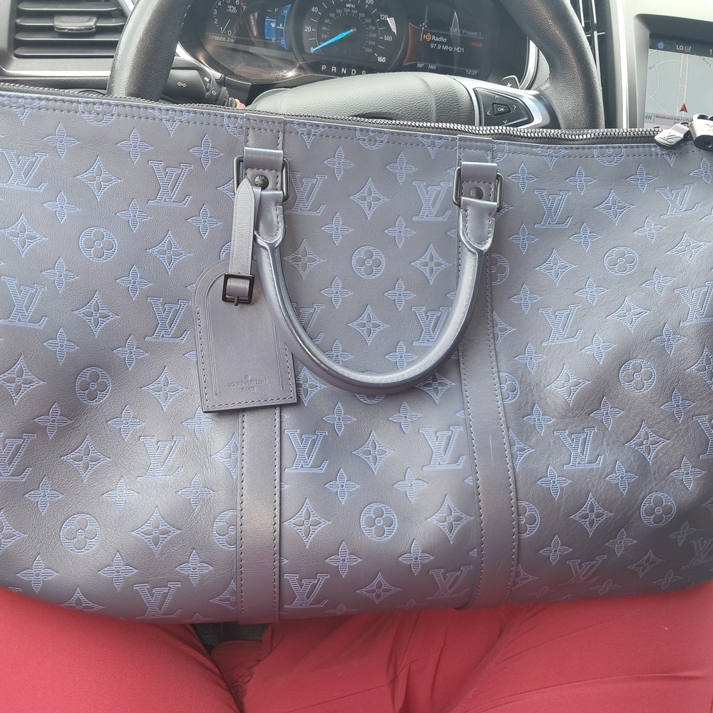 Louis Vuitton Gray Duffel Bag with Iconic Design